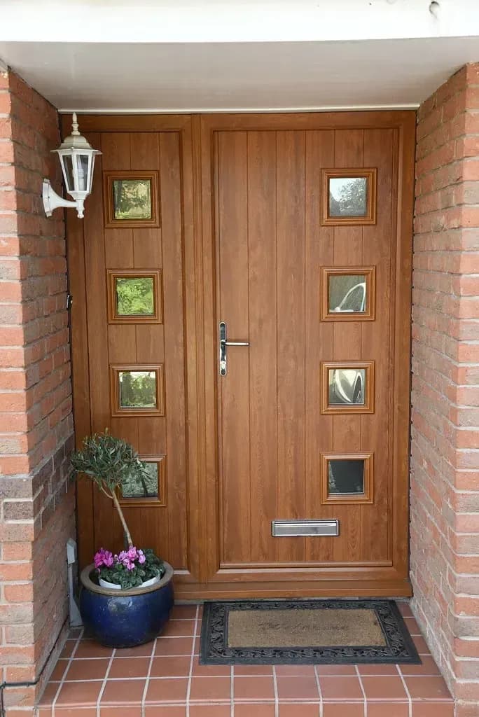 Flush anthracite aluminium entrance door with a long pull handle