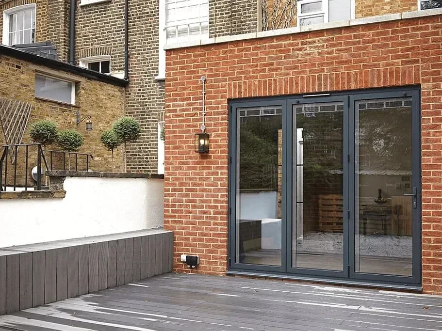 Powder-coated aluminium door and window frames in a muted colour